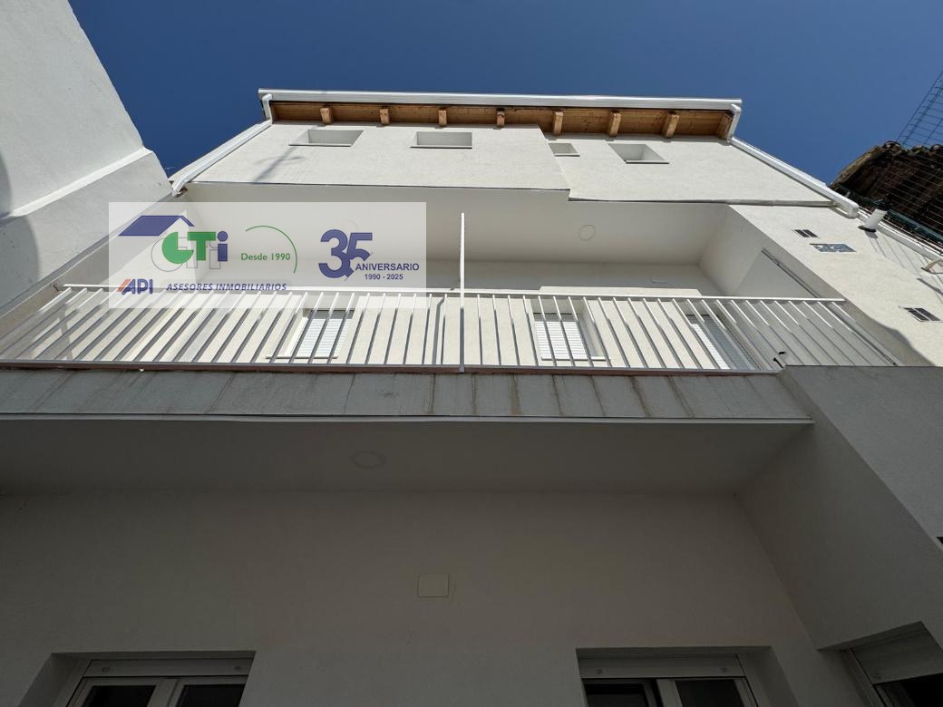 Casa de tres pisos.